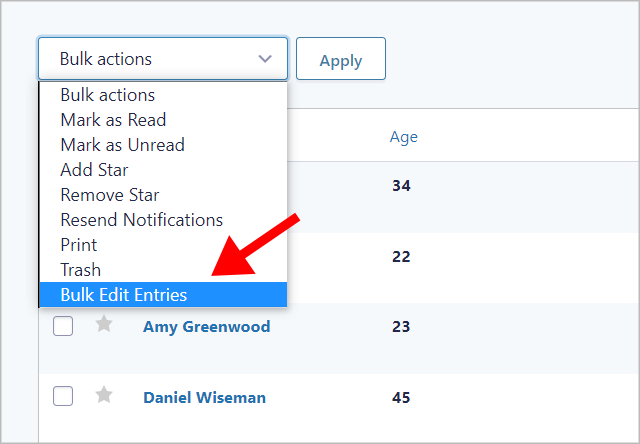 An arrow pointing to the 'Bulk Edit Entries' option in the Gravity Forms Bulk actions dropdown menu