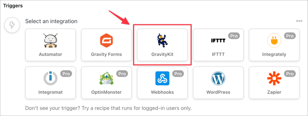 An arrow pointing to GravityKit in the 'Select an integration' menu in Uncanny Automator