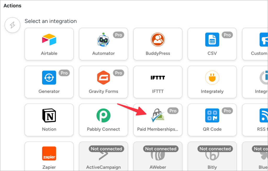 An arrow pointing to 'Paid memberships Pro' underneath 'Actions' in the Uncanny Automator recipe configuration screen.