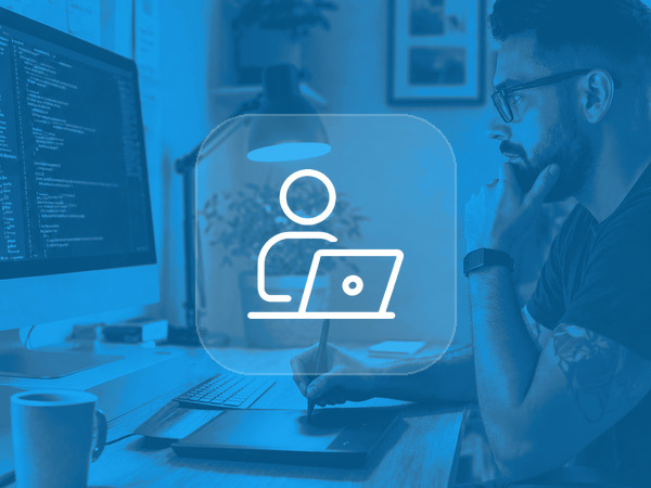 WordPress freelancer working at a desk with code on screen
